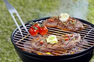 Tender steak grilling on a barbecue